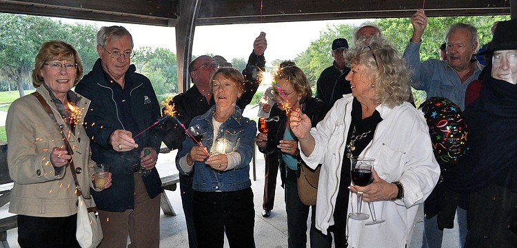 Members of the Sarasota British Club light up their sparklers as part of their Guy Fawkes celebration, Saturday, Nov. 5, at Twin Lakes Park.
