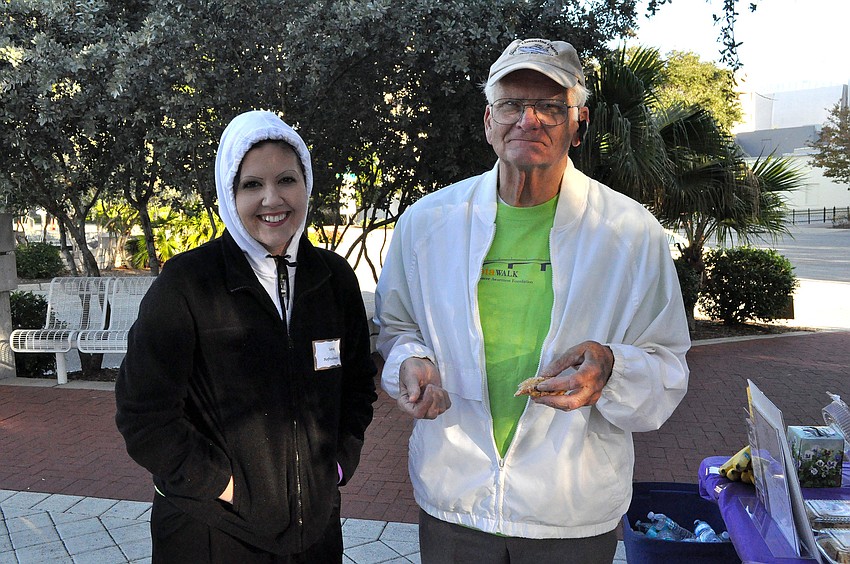 Volunteers Sarah Moorman and Jim Seaton try to stay warm.