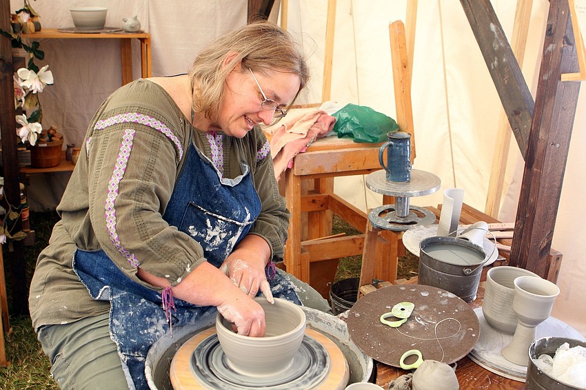 Gwenn Kennedy works on making a bowl on her potters wheel.
