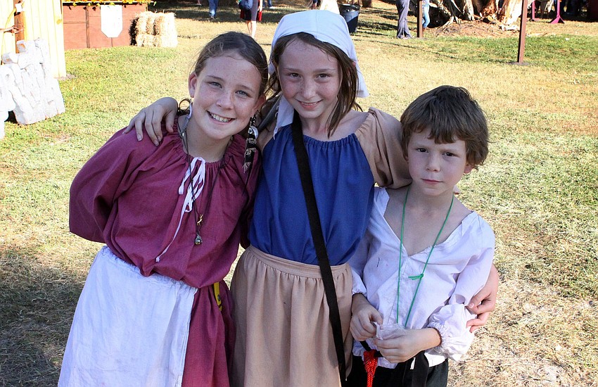 Peasant children Ciara Fortier, 10, Jersey Blosser, 11, and Roady Blosser, 8
