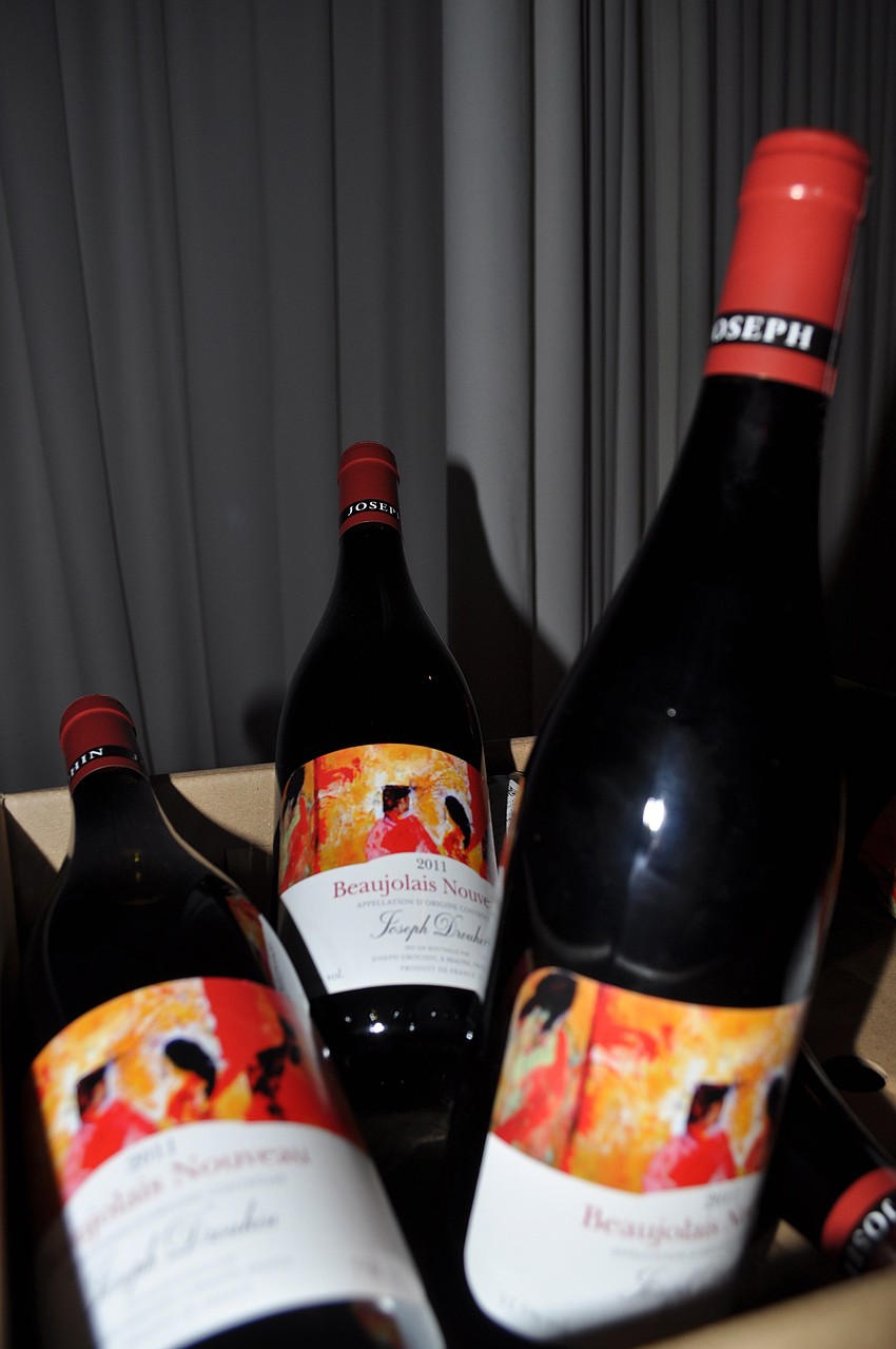 Bottles of Fete du Beaujolais Nouveau.  Every year on the third Thursday in November at midnight (in France), they pop the cork and celebrate the harvest of the wine.
