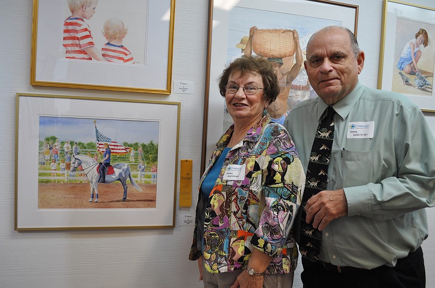 Becky and Denny Kedzierski in front of Beckyâ€™s piece 