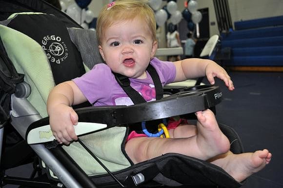 Ella Dyer, 11 months, had fun watching all of the people at Thunder Fun Day. Photo by Jen Blanco.