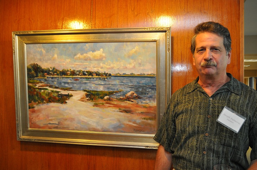 Joe Palmerio with his oil painting â€œBayfrontâ€