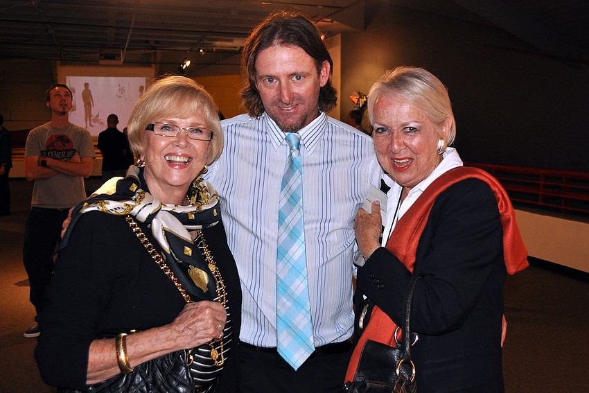Joyce Dixon and Barbara Campo pose with artist Tom Stephens.