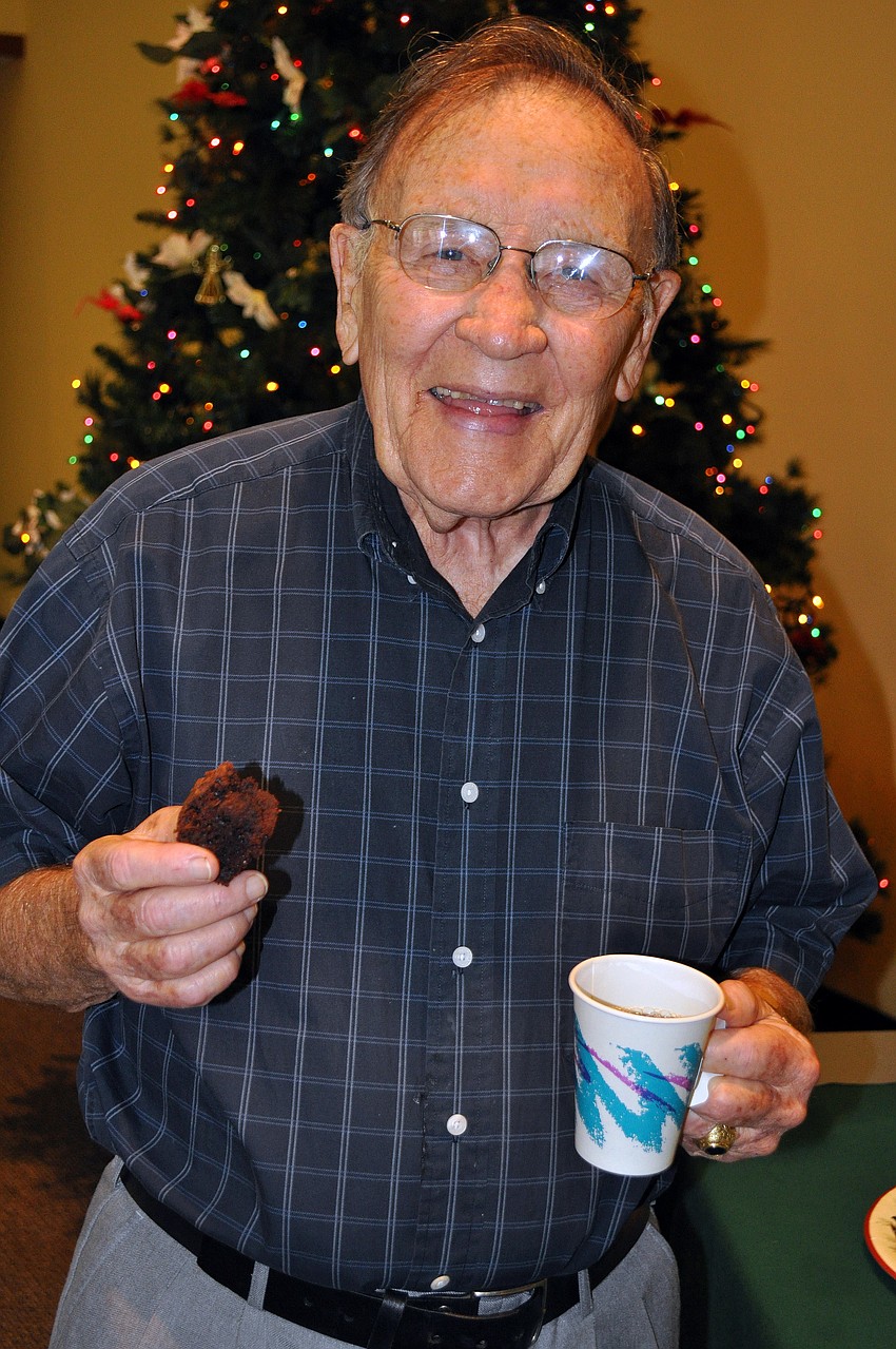Don Harvey has himself some coffee and a sweet at St. Bonifaceâ€™s annual Cookies and Carols event, Sunday, Dec. 11, inside St. Bonifaceâ€™s Parish Hall.
