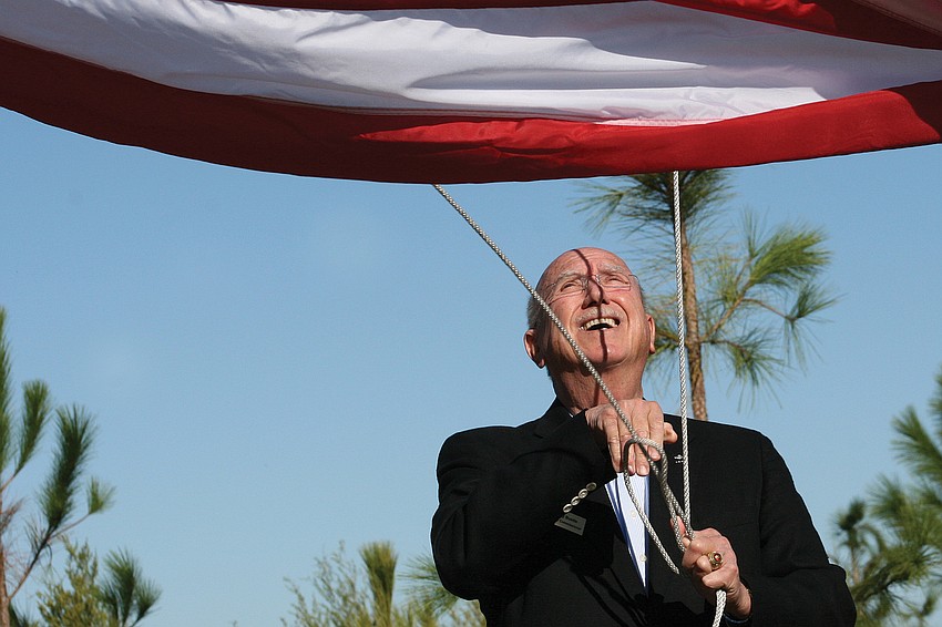 Manatee County Commissioner and veteran Larry Bustle participated in the flag-raising ceremony during the grand opening of Bennett Park Nov. 12. Published Nov. 17, 2011.