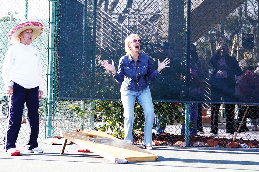 Cathy Powell and Kim Lawrence played in a cornhole game in January during the Longboat Key Public Tennis Centerâ€™s chili cook-off competition.
