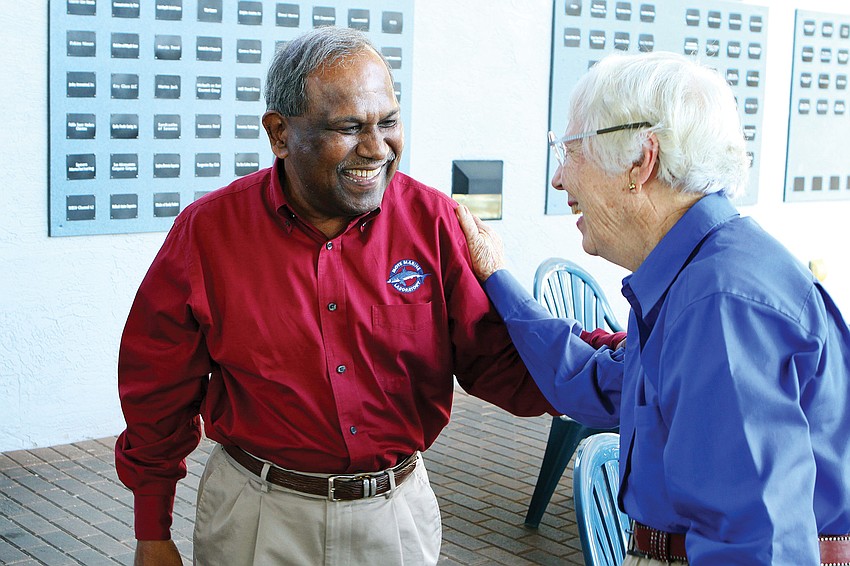 Dr. Kumar Mahadevan laughed in March with Mote Marine trustee Pauline Becker, during Mahadevanâ€™s surprise party celebrating his 25 years as CEO.