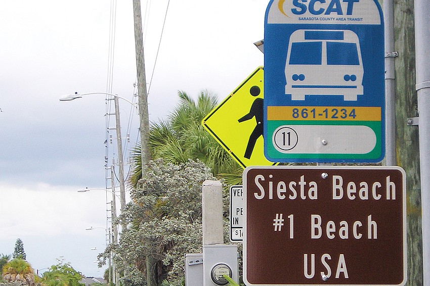 The No. 1 beach signs erected at county bus stops did not win rave reviews.