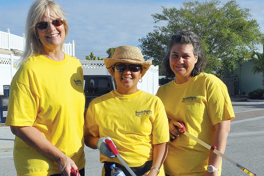 Catherine Luckner, Beverly Arias and Maria Shay helped clean up the Key during the quarterly Adopt-A-Road event.