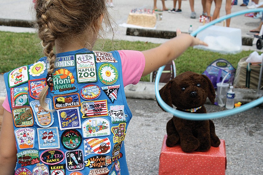 Six-year-old Faith Chaney threw a hula-hoop around a stuffed dog at the Girl Scouts of Gulf Coast Floridaâ€™s 100th anniversary of Girl Scouts festival in September.