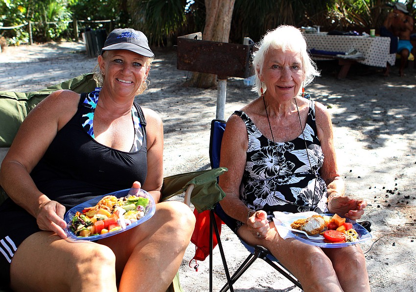 Jan Buncik enjoyed some of the potluck food and music with her mother, Jean Hewitt, Saturday, Sept. 24 at Siesta Key Public Beach.