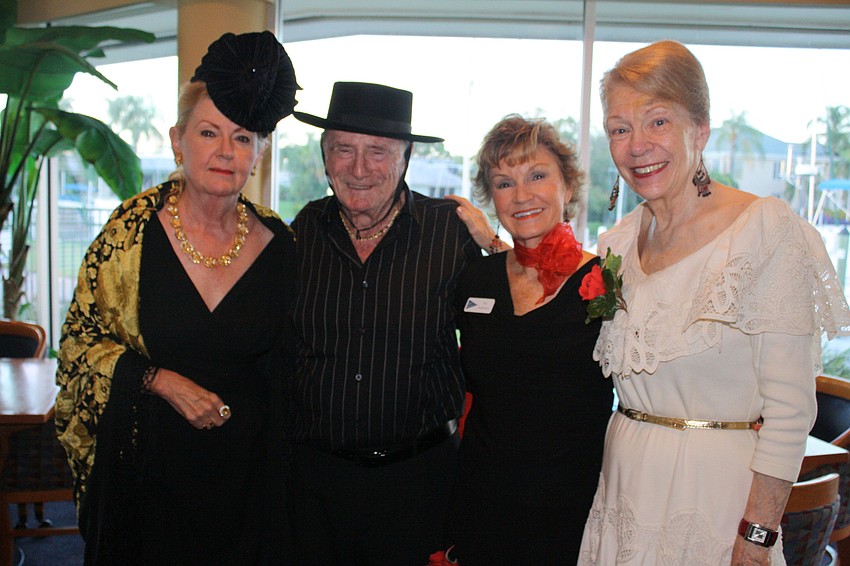 Spanish-themed dressers Sally and Jack Janet, Pat Anderson and Diane Gaillet pose for a photo.