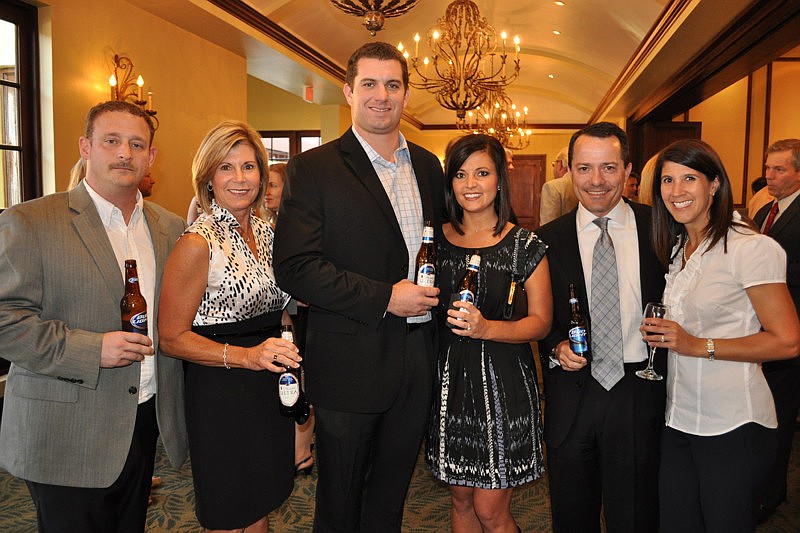 Gold Coast Eagle Distributing's Chris Reynolds, Denise Saputo and Devyn and Bethany Dugger with Fran and Maria Lutz of Wells Fargo