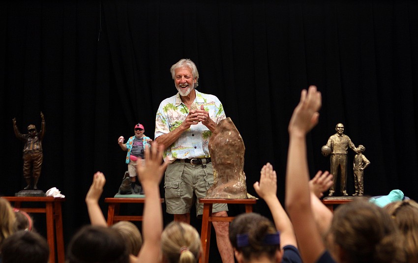 Jack Dowd laughs during a question and answer session with the fourth grade art class Thursday, Oct. 13 at ODA.