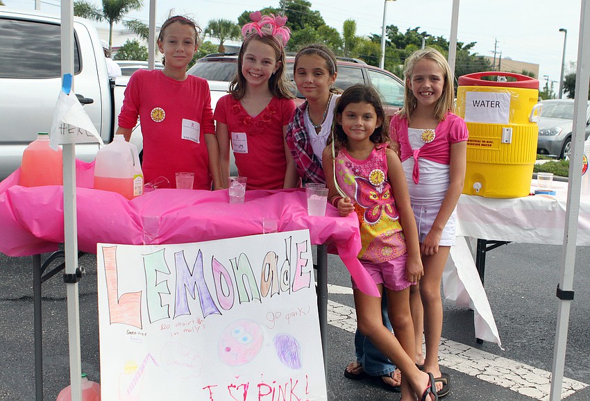 Erin Luhrsen, Ashlynn Rutherford, Savina Koda, Sofia Koda and Ansley Jackson ran a pink lemonade stand out in the parking lot. Last year the girls raised $57.