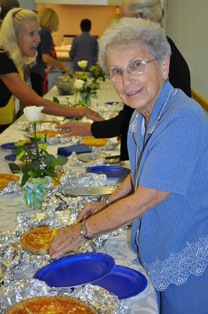 Stella Kelley serves up the vegetarian quiche.