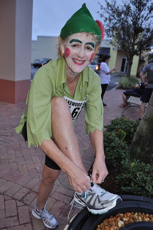 Denise Prudy gets her laces ready for the run.