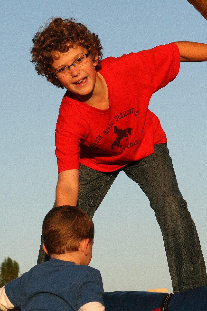 Jack Mungillo, 10, helped a friend up this obstacle course.