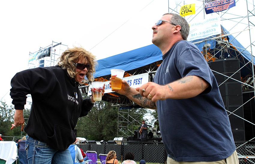 Tamala Moore dances with her brother, Jerry, at the 21st annual Sarasota Blues Fest, Saturday, Nov. 5, out by Ed Smith Stadium.