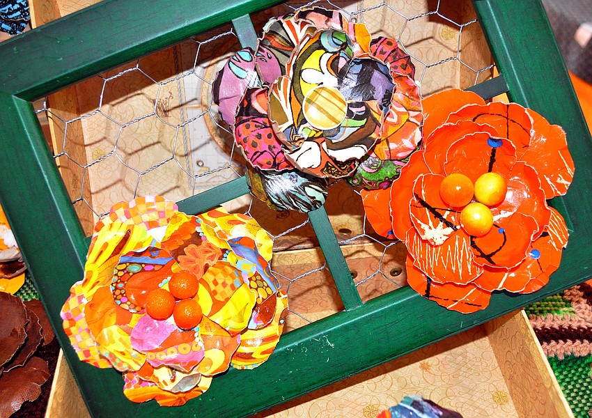 Peachy Green Brand was selling their broaches made out of old album covers, Saturday, Nov. 12, inside Crocker memorial church during Pioneer Day.