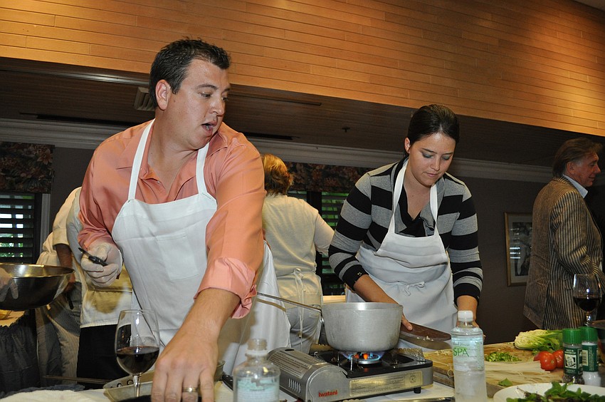 Paul and Theresa Kauffman prepare their chicken dish. It was a judge favorite.
