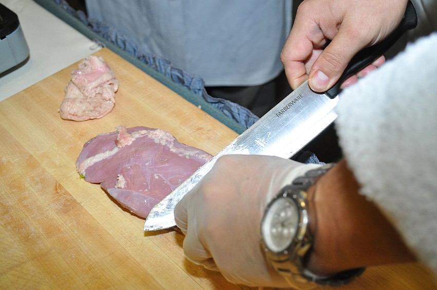 Trimming the fat off of the duck