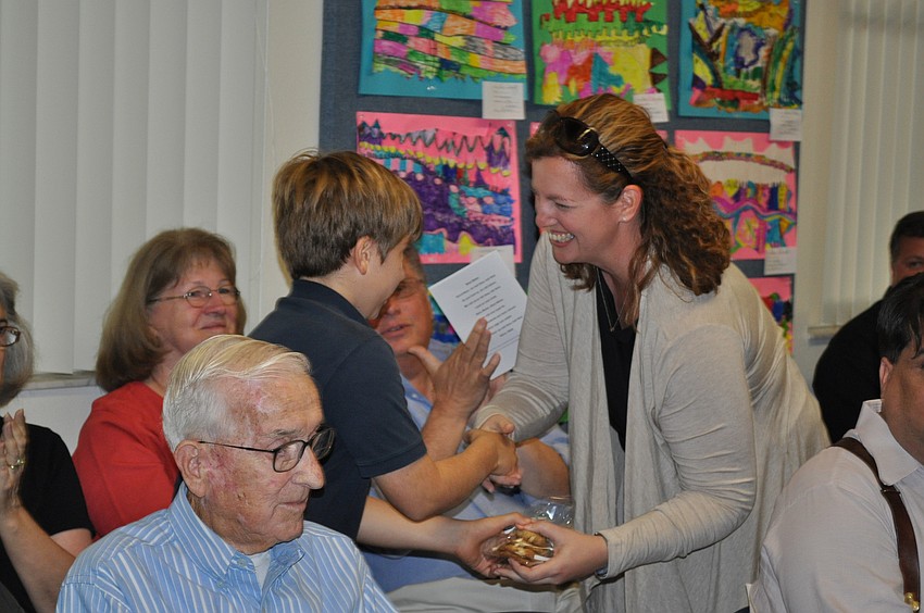 Ethan Marino presenting to Melanie Custer