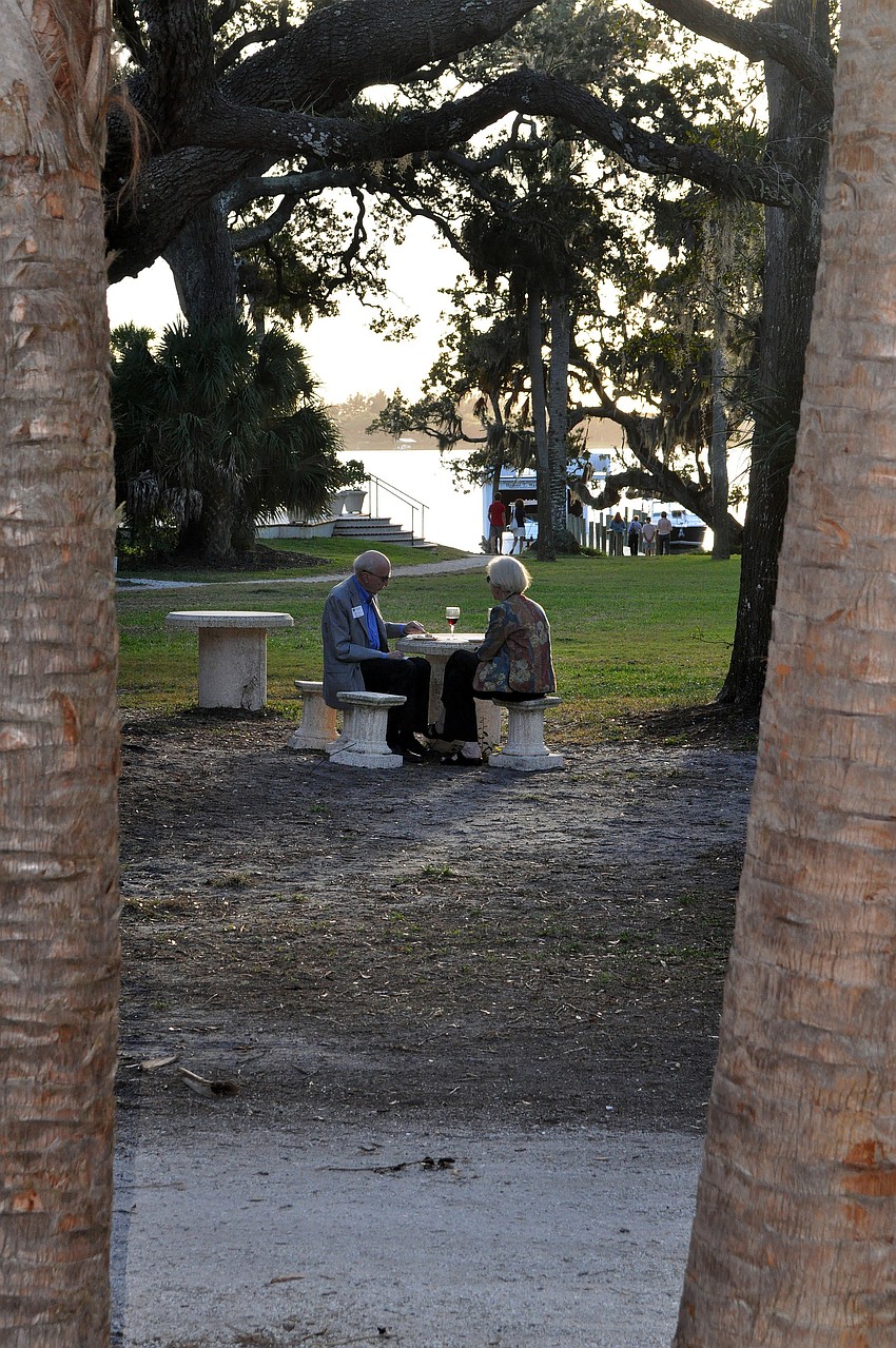 Howard and Jean Emery enjoy their food and wine out at a picnic table at Bay Preserve.