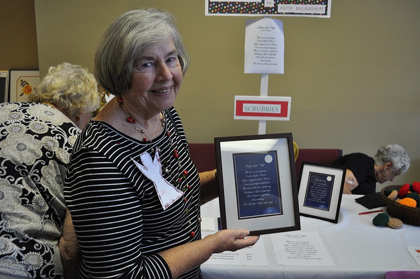 Patsy McLaughlin stands in front of her original poetry