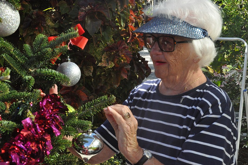 Emily K. Jones hangs an ornament