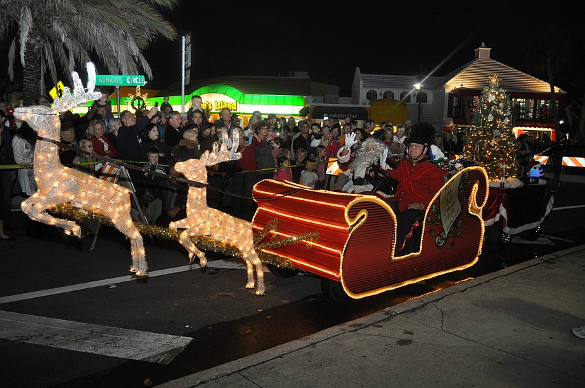 Santa Claus arrived in style: Rudolph led Santaâ€™s sleigh, a nutcracker steered the way and the caboose had a Christmas tree and a bubbles came from the back end.