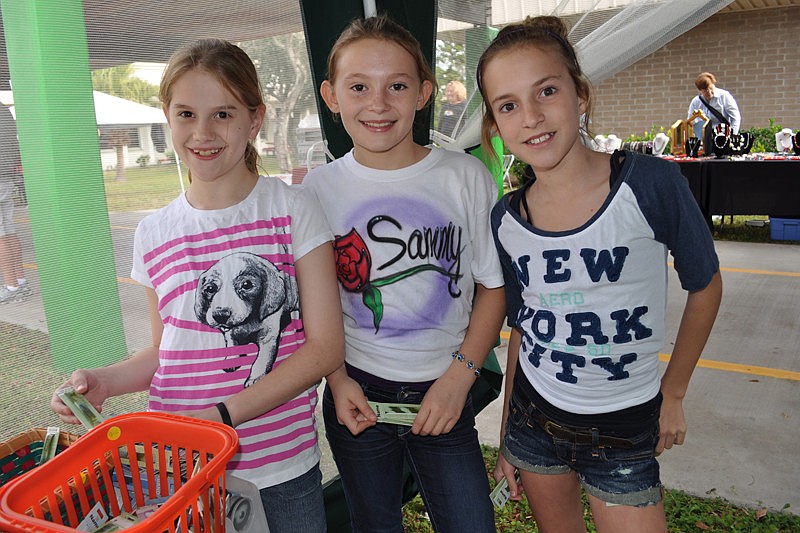 Briana Kendzior, Samantha Casper and Katie Burke hunted through the name bracelets with vigor.