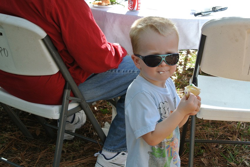 Owen Boyle eats a cupcake.