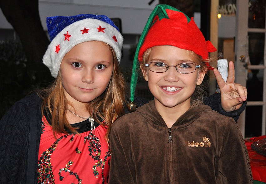 Avalon Jopson and Sammi Snow, 9, pose together, Friday, November 9, during Southside Stroll.