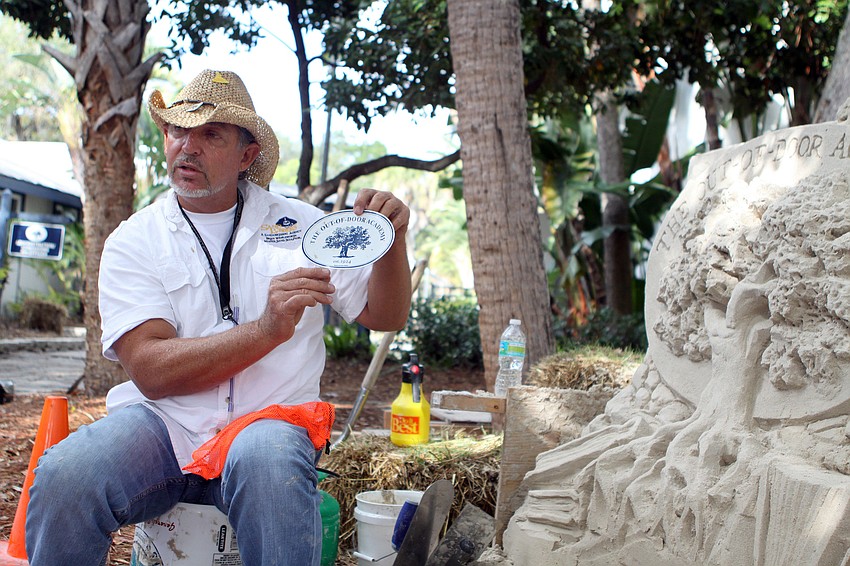 Brian Wigelsworth explains how he modeled his sand sculpture off of a magnet with the ODA logo.