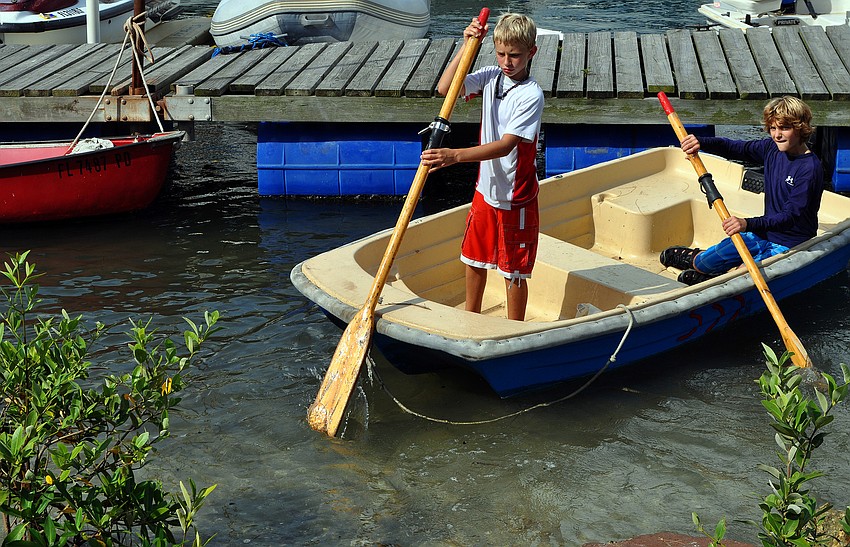 Matthew Liebel, 9, and Ryan Arrigo, 11, play around in a row boat after sailing earlier in the day Saturday, Sept. 3 in the 65th Labor Day Regatta at the Sarasota Sailing Squadron.
