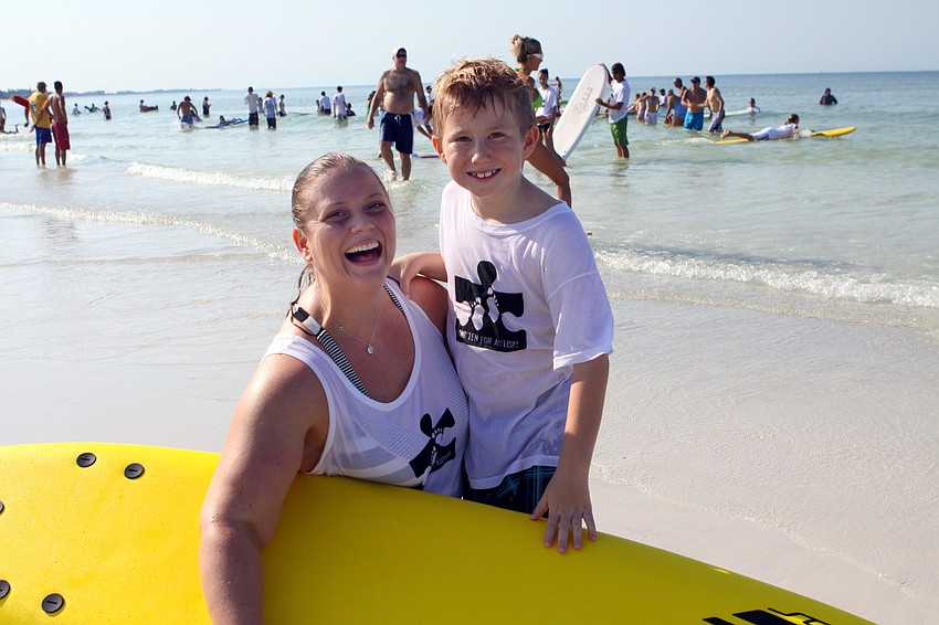 Laney London and Luke Penker, 7, pose together Saturday, Sept. 17, at the Siesta Key Public Beach.