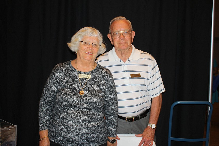 Regular volunteers at All Faiths Food Bank Mary and Wendell Hough man the booth.