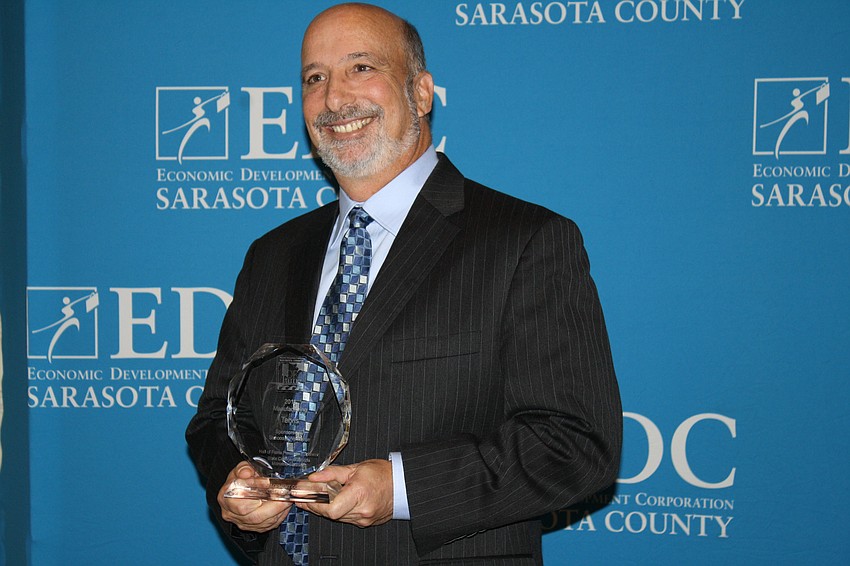 The Manufacturing Award was presented to CEO Barry Wolfson of Tervis. The award was presented by Mark Kennell, Suncoast Workforce board member.