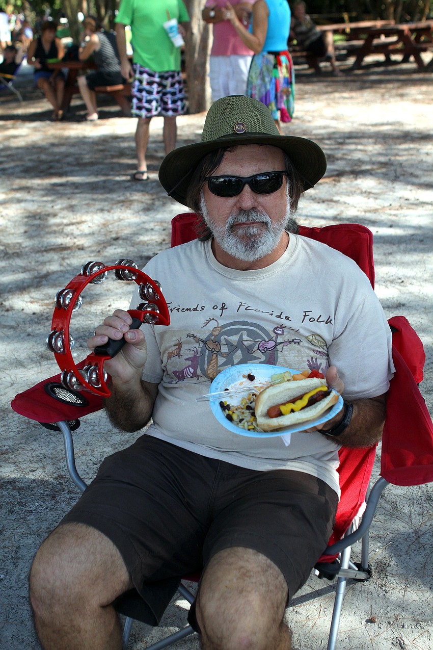 Gary Fuller played his tambourine from the audience while enjoying some food at the 4th Annual Siesta Key Beach Bash Saturday, Sept. 24 at Siesta Key Public Beach.