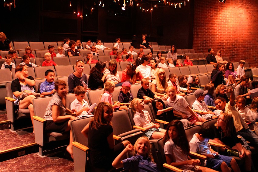 Student from IMG Pendleton and St. Marthaâ€™s School wait patiently for the show to begin Tuesday, Sept. 27 at the Gompertz Theatre.