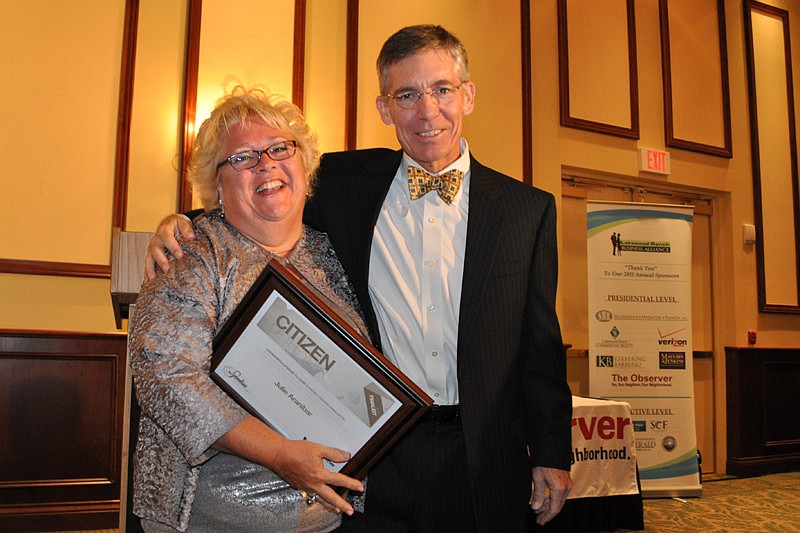 Manatee County School Board member Julie Aranibar receives a finalist award for Citizen of the Year from The Observer Group Editor and CEO Matt Walsh.