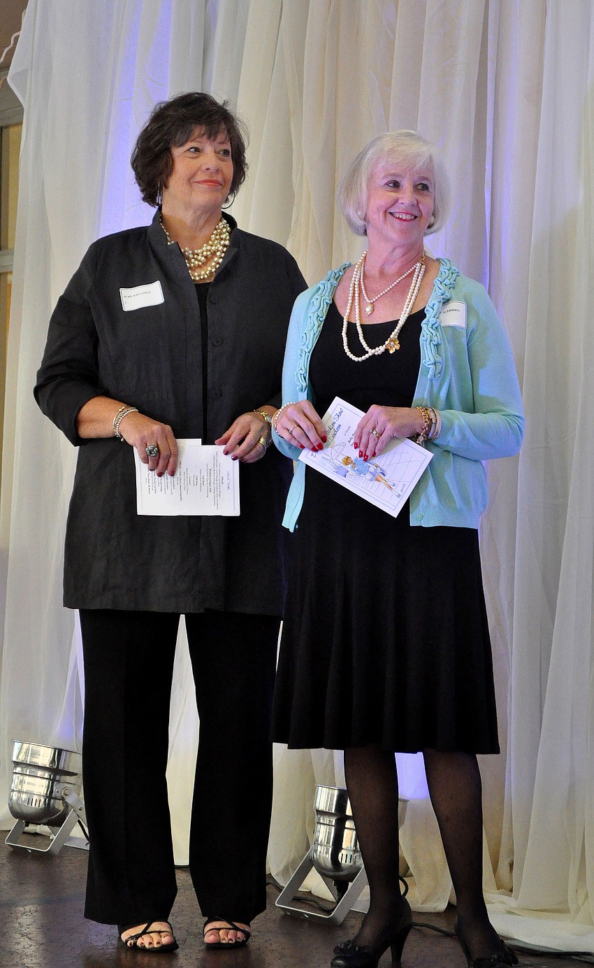 Founder of Baby Basics, Jean Ann Lynch, stands on stage with the President of Baby Basics Sarasota, Sandra Slaminko.