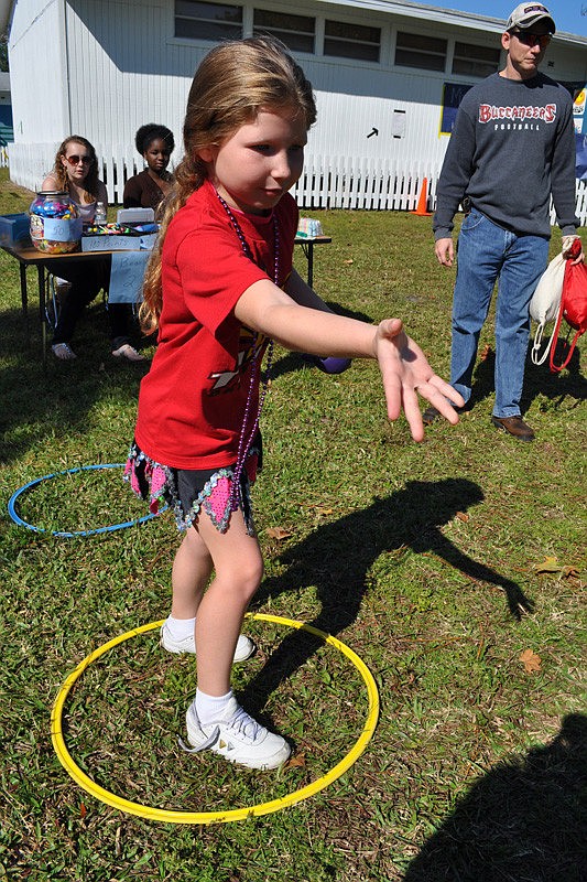 Jillian Walker, 7, tried her hand at the bean bag toss.