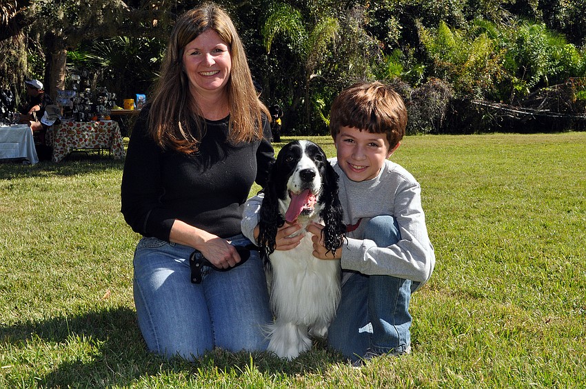 Pasha and Brandon, 8, Meimann pose with their dog, Lady, 13.
