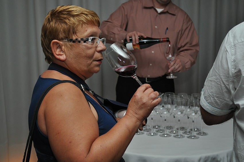 Francoesca Lasuaur smells her wine