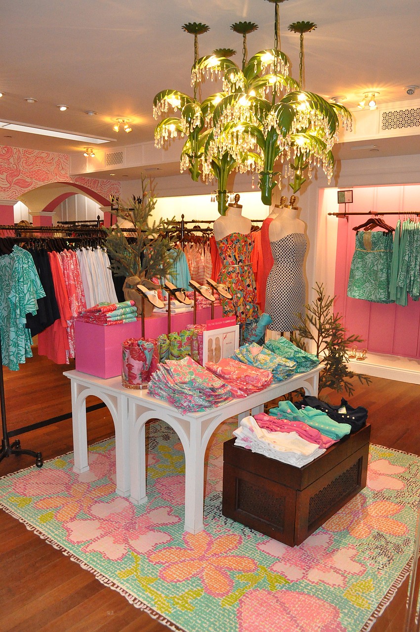 There used to be a white, ceramic palm tree where there is now a painted rug and green palm tree chandeliers.