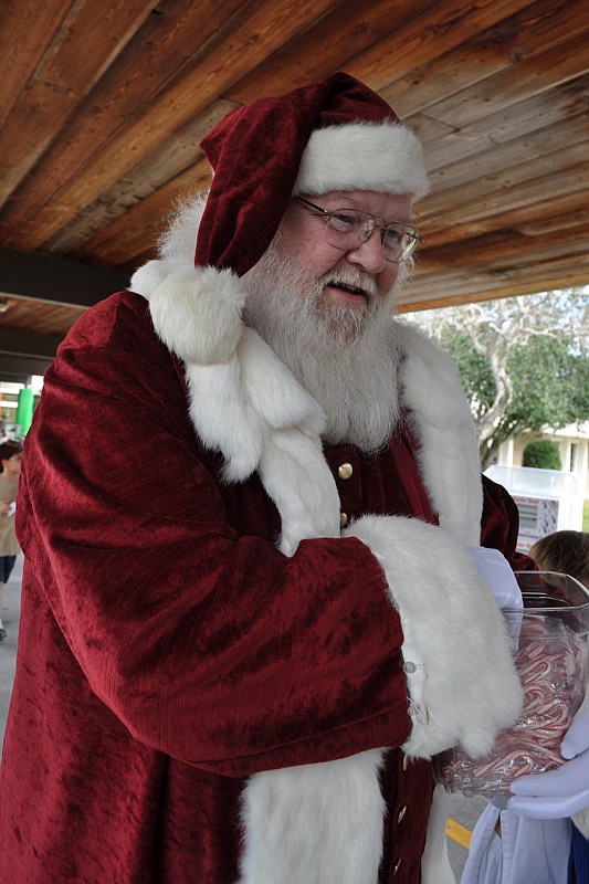 Santa Claus distributed candy canes to children.